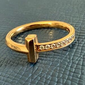 Tiffany and Co 18k Rose Gold "T" ring with diamonds